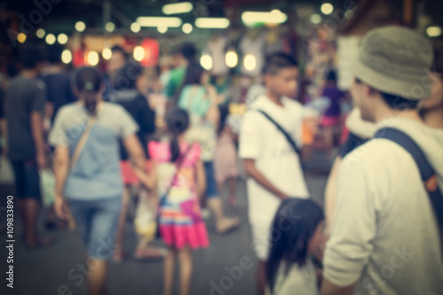 Blurred people are in the market