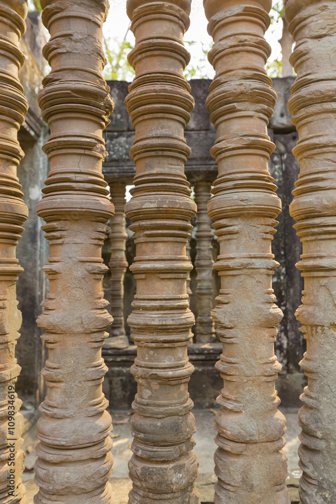 Turned stone bars of a window at the Khmer temple of Angkor Wat
