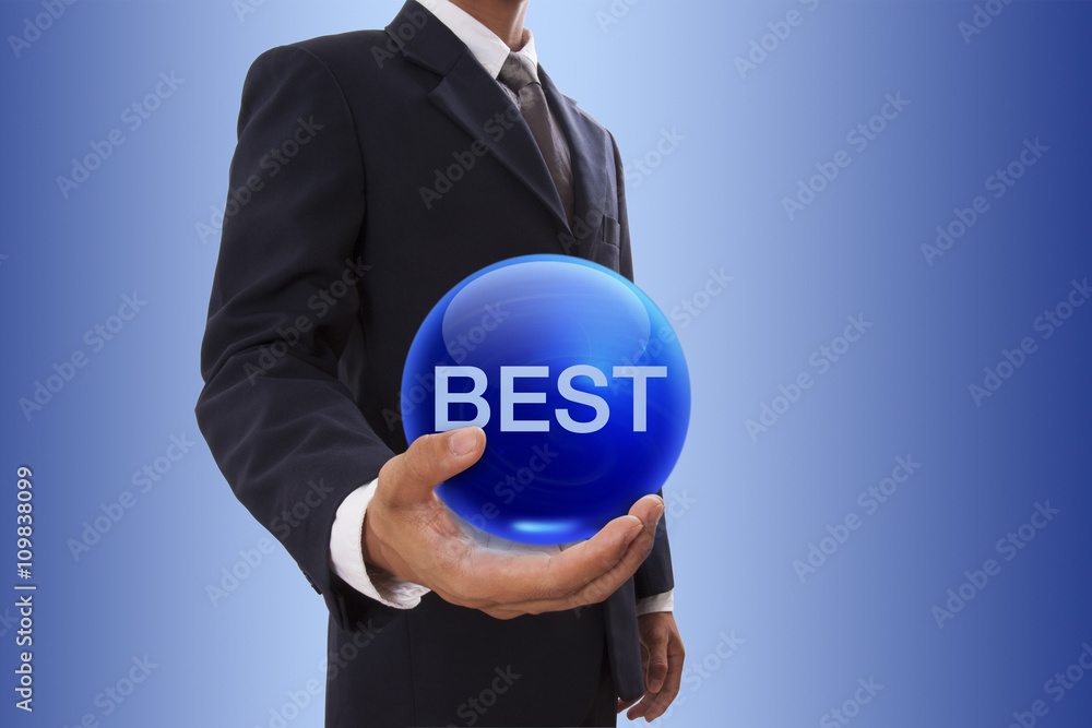 Businessman hand holding blue crystal ball with best word. Businessman hand holding blue crystal ball with best word.