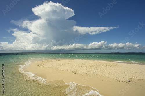Beautiful white clouds over a small island in Zanzibar