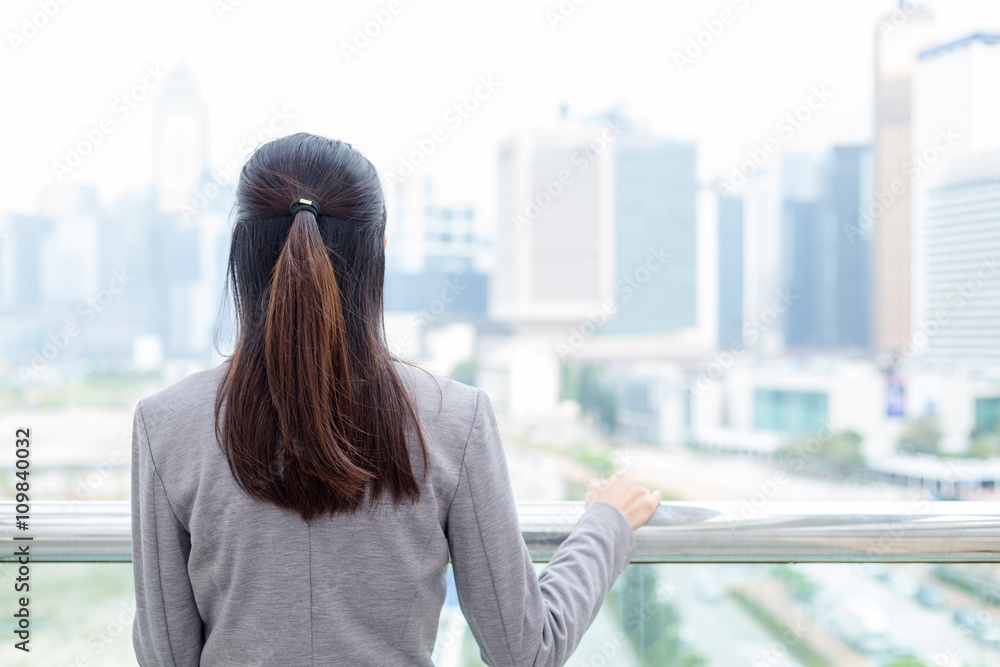 Fototapeta premium Back view of businesswoman