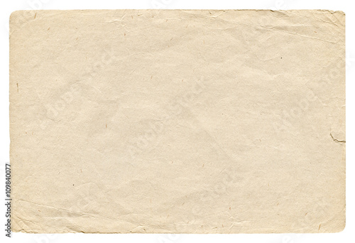 Vintage light crumpled paper blank with torn edges isolated on white background. Old texture for design. 