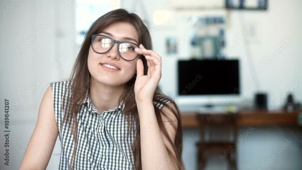 young woman using tablet computer at office or school. look at camera young woman using tablet computer at office or school. look at camera