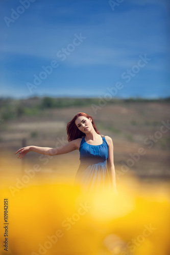 Wallpaper Mural Woman in yellow tulips field outside Torontodigital.ca