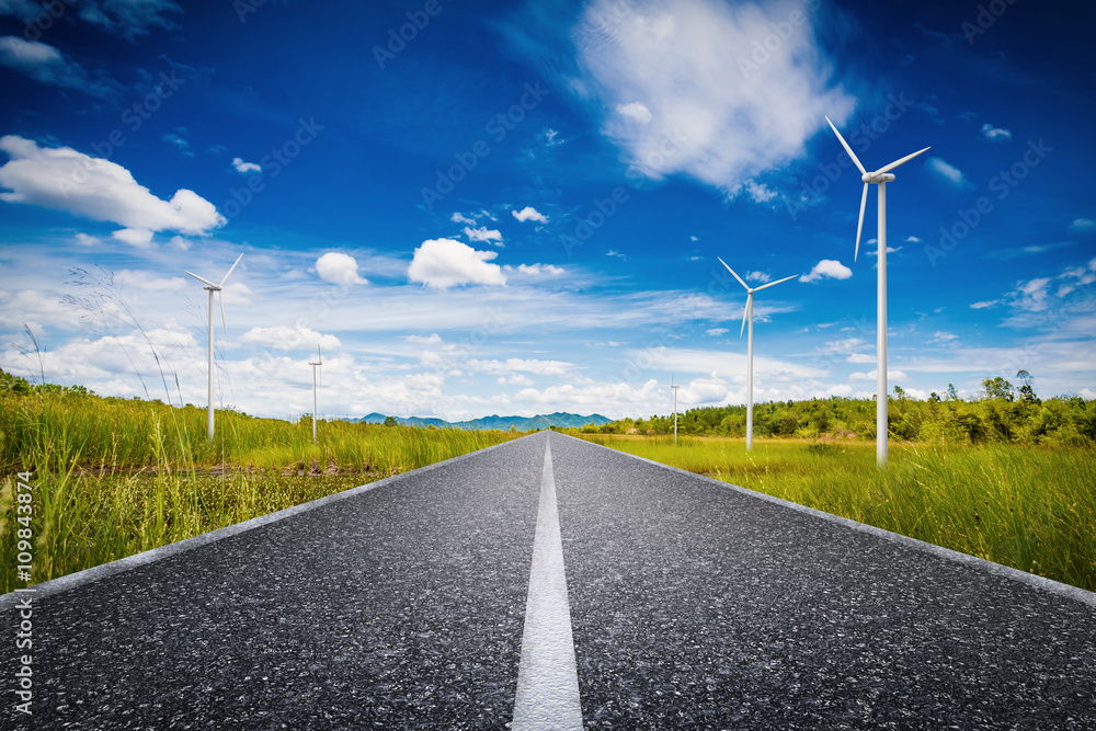 eco road concept with turbines and green field