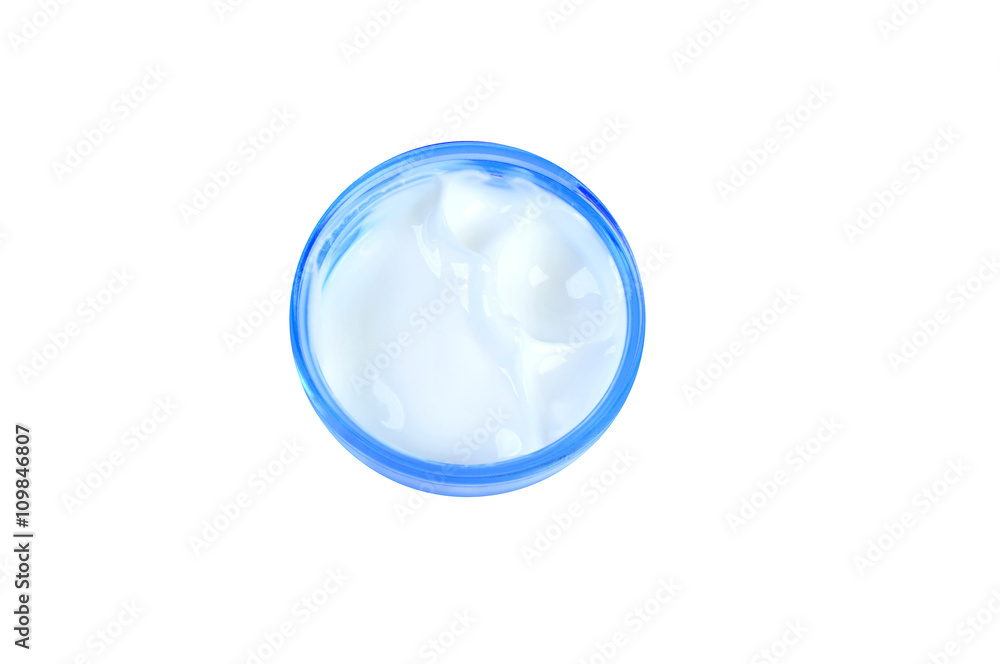 tub with a face cream with a blue cover on a white background tub with a face cream with a blue cover on a white background
