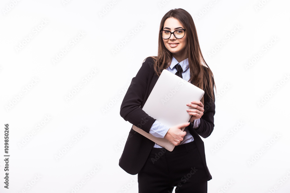 Businesswomen holding a laptop in her crossed arms Businesswomen holding a laptop in her crossed arms