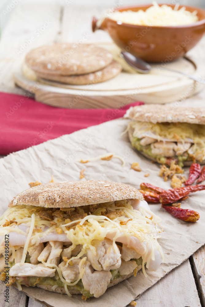 Sandwich with chickend and guacamole, cheese. Sandwich with chickend and guacamole, cheese.