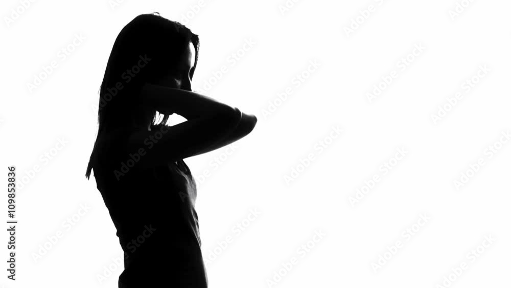 Woman combing her hair Woman combing her hair