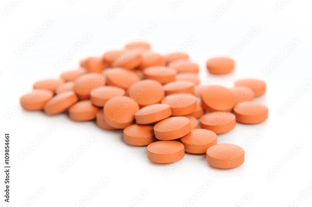 orange pills. Isolated on a white background orange pills. Isolated on a white background