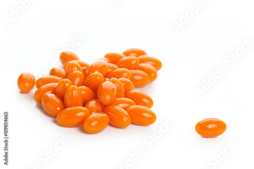 orange pills. Isolated on a white background