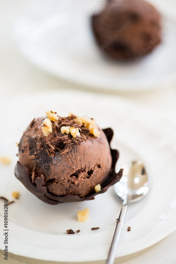 Chocolate Ice Cream Scoop is laying on Chocolate Homemade Bow Chocolate Ice Cream Scoop is laying on Chocolate Homemade Bow