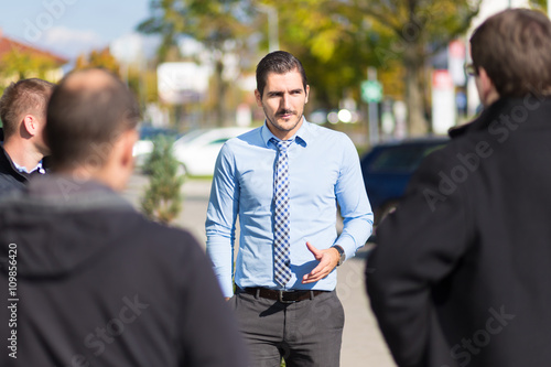 фотографія Businessman being approached and blackmailed by racketeers.