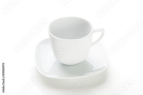 Empty white mug on white background