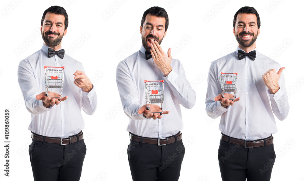 Waiter with beer bottles on the tray holding a supermarket cart Waiter with beer bottles on the tray holding a supermarket cart