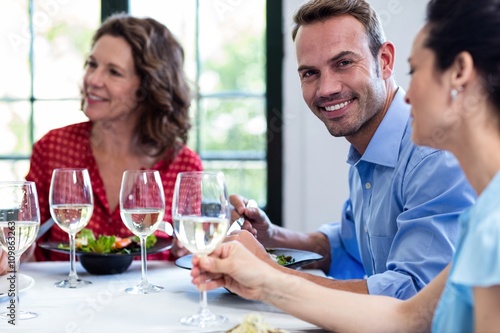 Portrait of man having lunch with his friends