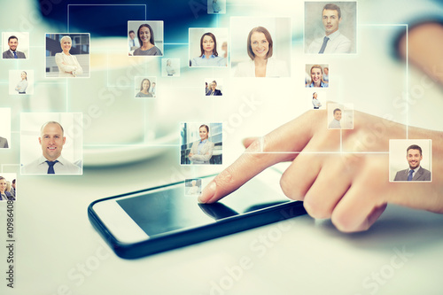фотографія close up of hand with smartphone and contacts