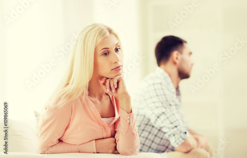 unhappy couple having argument at home