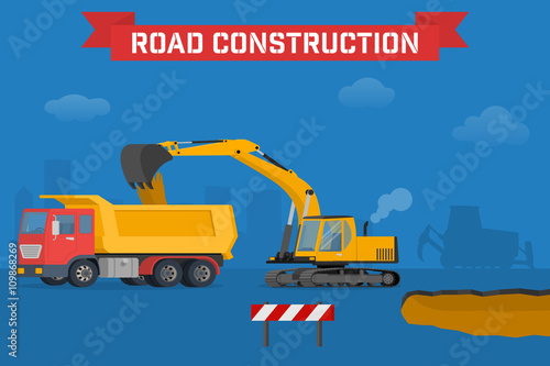 Excavator digging pit in the ground and load truck.