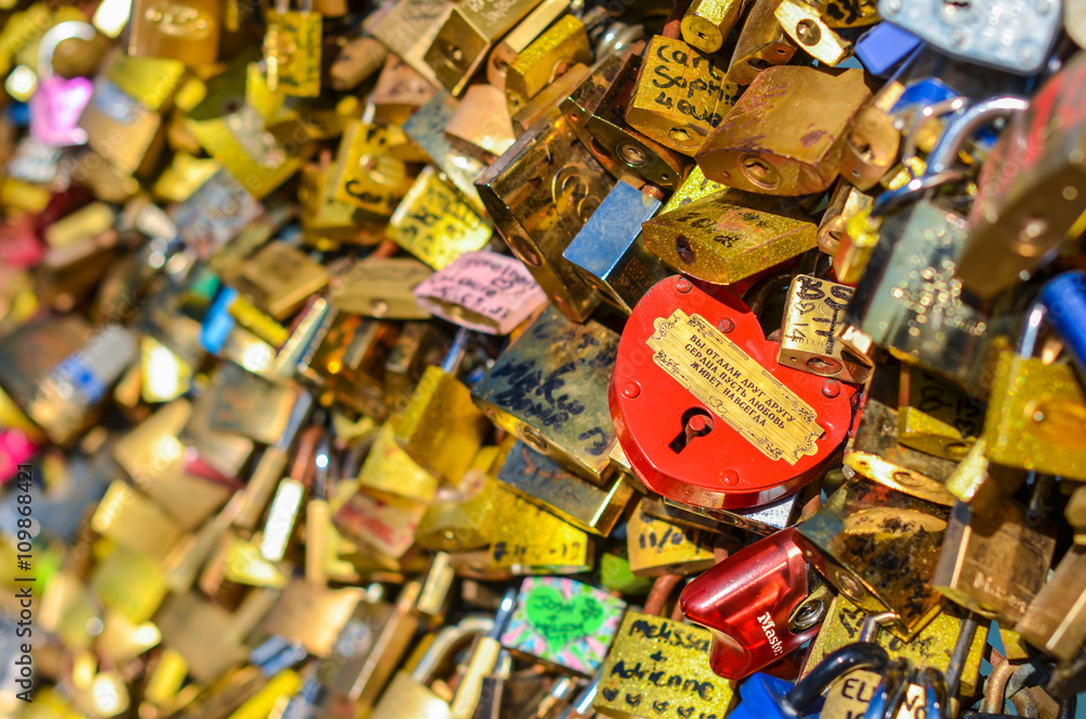 PARIS - APRIL 2014: Love Padlocks at Pont des Arts on April 17, 2014, in Paris, France. Lots of colorful locks on a bridge symbolize love forever.