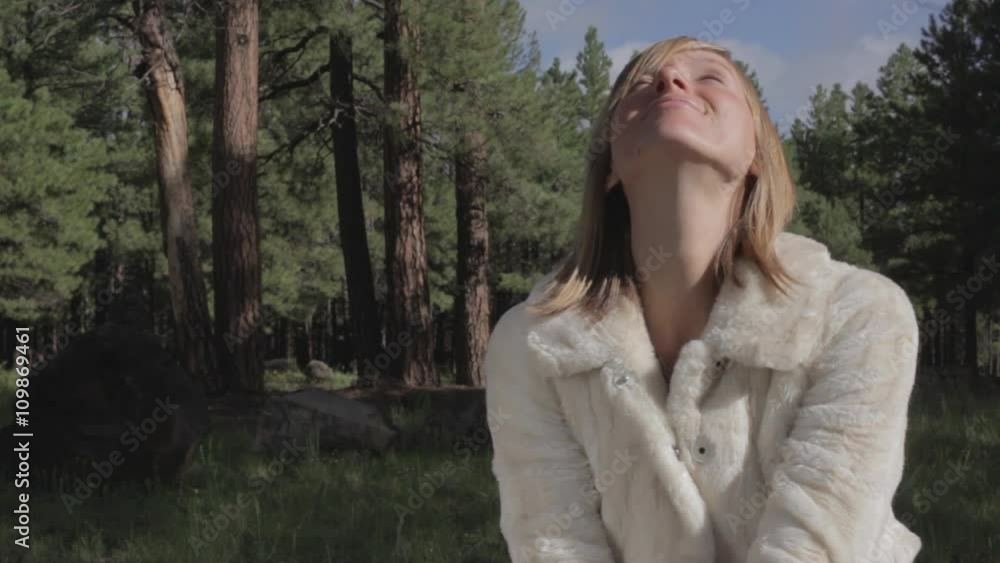 A woman in prayer - meditation in the woods A woman in prayer - meditation in the woods