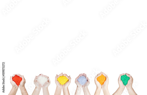 Colored plastic beads on hands