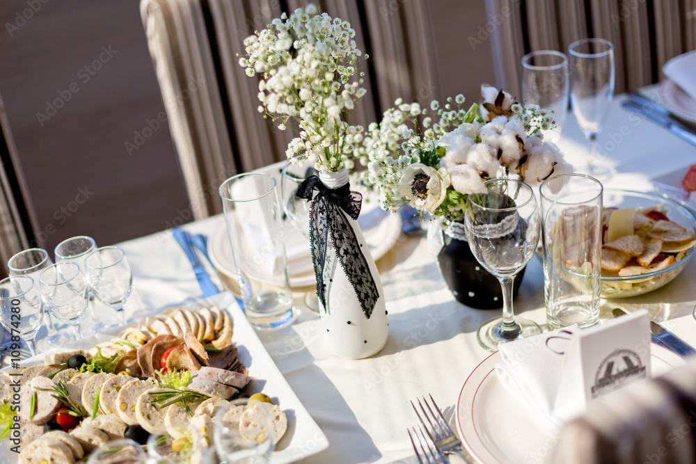 Decoration of wedding table with food and flowers