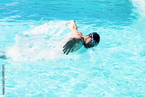 Fit swimmer doing the butterfly stroke