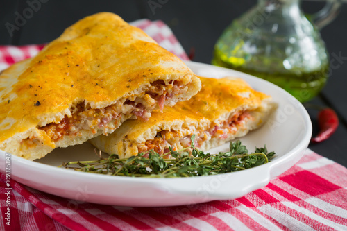 Pizza calzone with ham and cheese