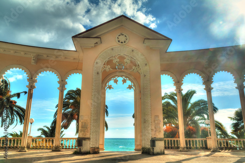 Canvas Print Arch of Colonnade in Gagra, Abkhazia, backlit against the sky, HDR processing