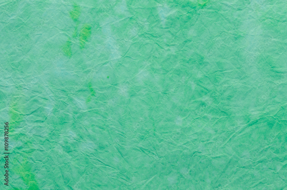 green painted crepe paper background green painted crepe paper background