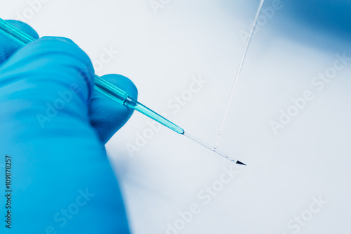 Vitrification  (cryostorage) of sperm samples or oocytes, in vitro fertilization process close up. photo