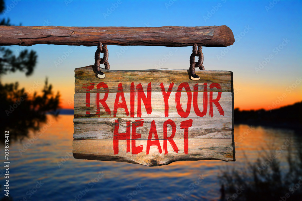 Fototapeta premium Train your heart motivational phrase sign