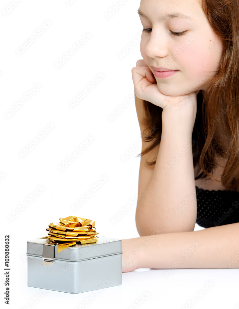 Young girl with beautiful gift box - closeup of present on white background. Young girl with beautiful gift box - closeup of present on white background.