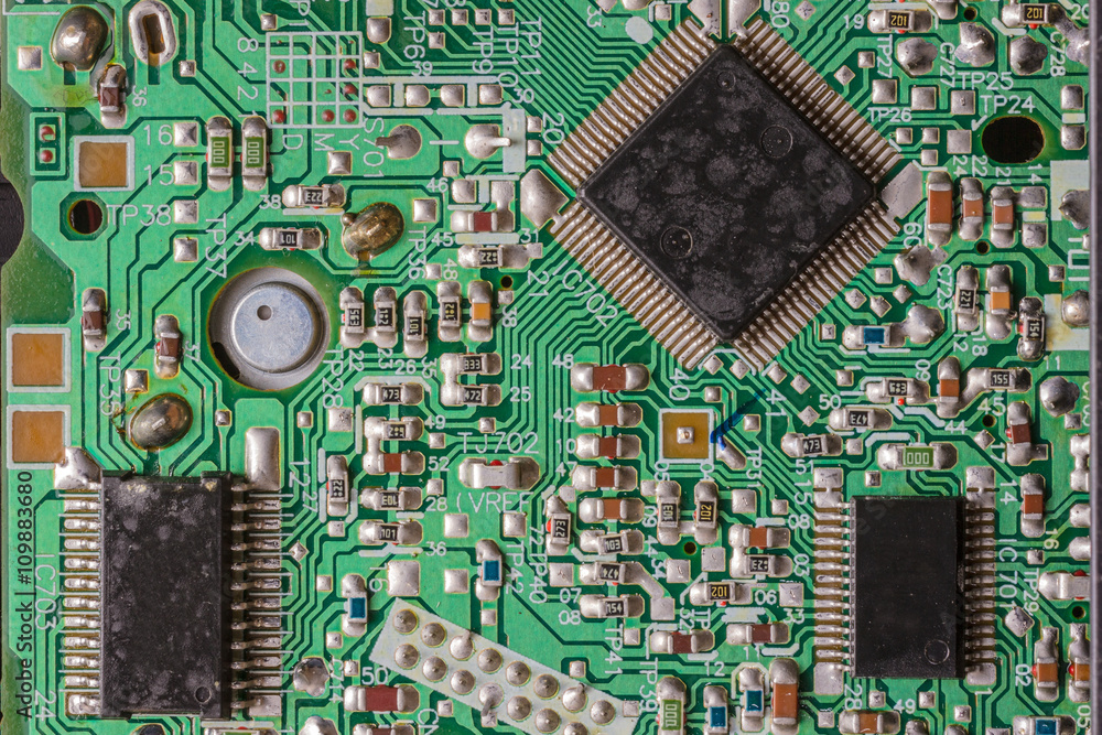 Close-up shot of an old and used integrated circuit board Close-up shot of an old and used integrated circuit board