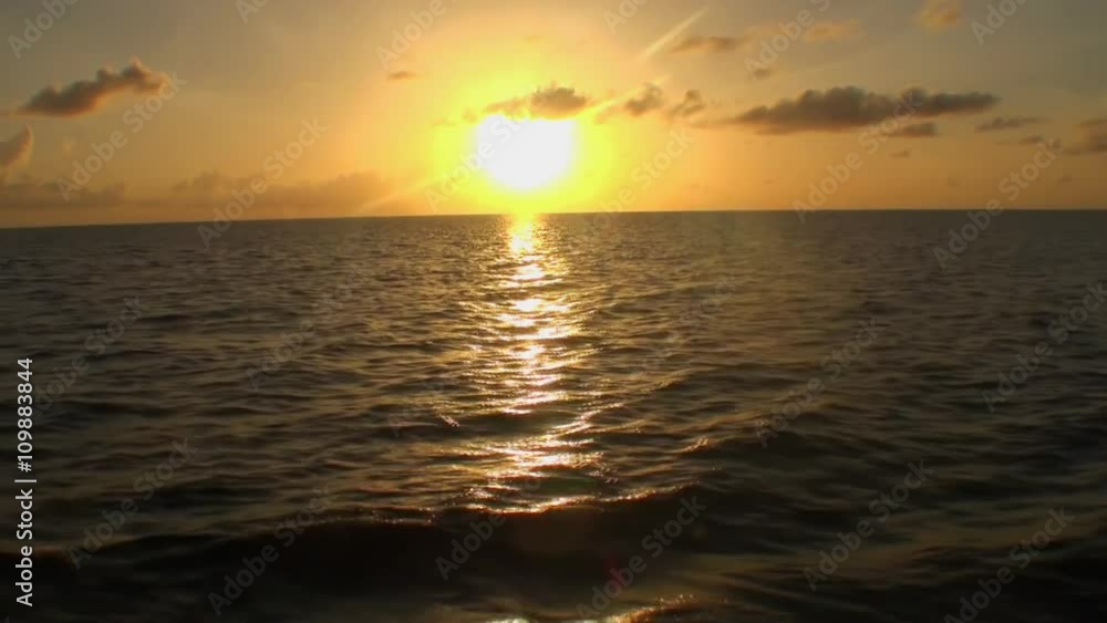 Beautiful sunset in sea, amazing colors, light beam shining through the cloudscape over the arabian gulf seascape, united Maldives Beautiful sunset in sea, amazing colors, light beam shining through the cloudscape over the arabian gulf seascape, united Maldives