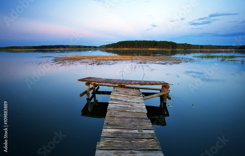 Old Wooden pier on the lake. Long exposure.