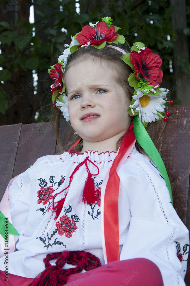 beautiful girl in traditional embroidered shirt jacket in the garden beautiful girl in traditional embroidered shirt jacket in the garden