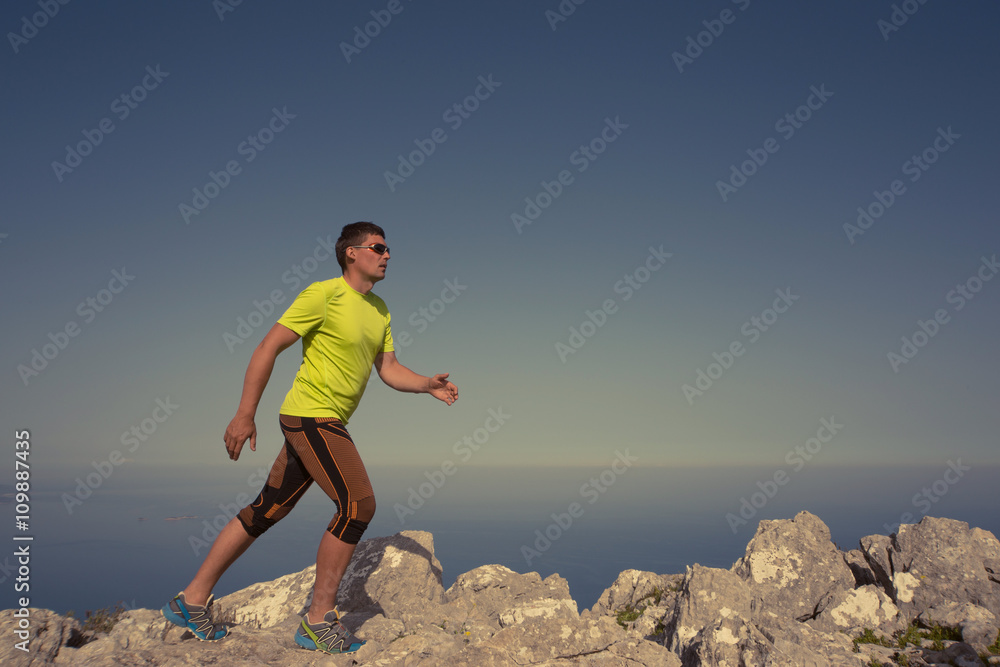 Running man in the summer in a beautiful location. Running man in the summer in a beautiful location.