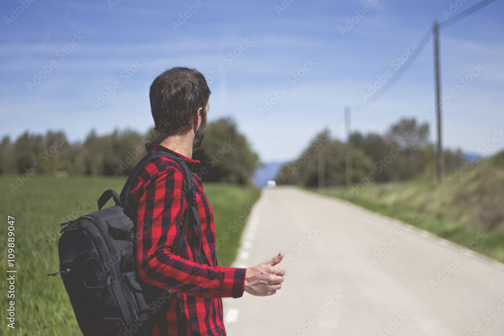 hipster doing hitchhiking