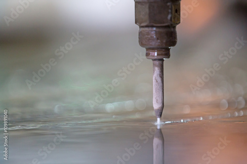 High pressure Water jet with abrasive particles  Cutting granite or marble tiles at Factory Workshop