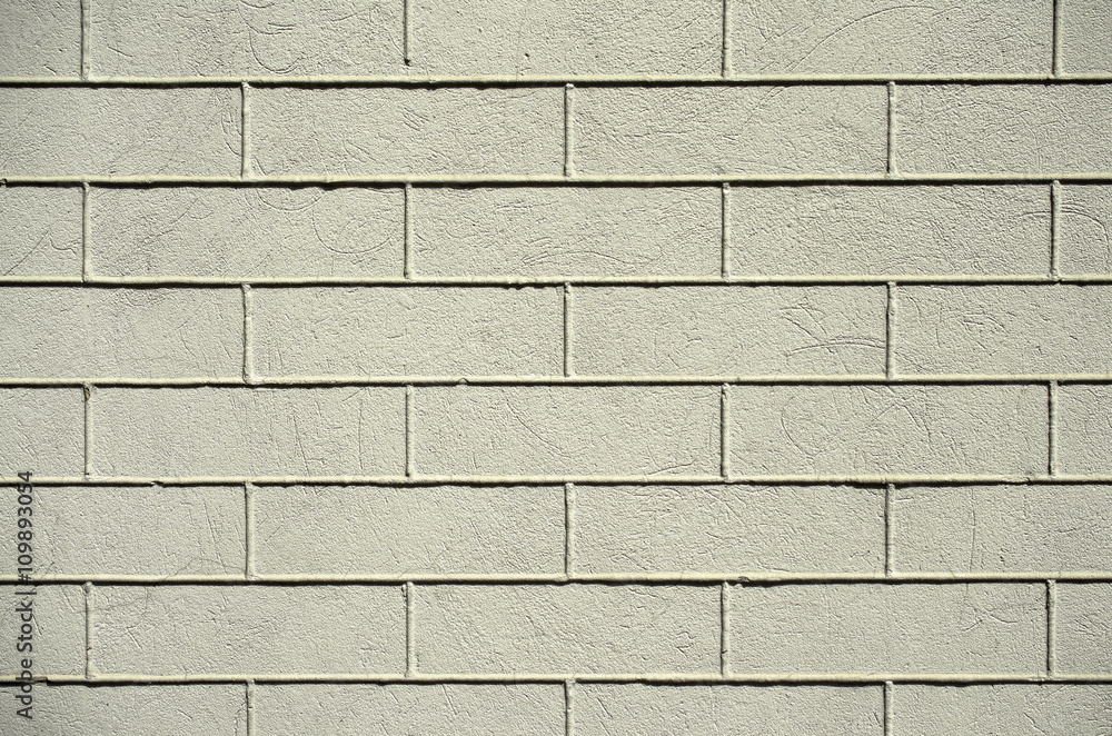Obraz premium Old gray painted brick wall.