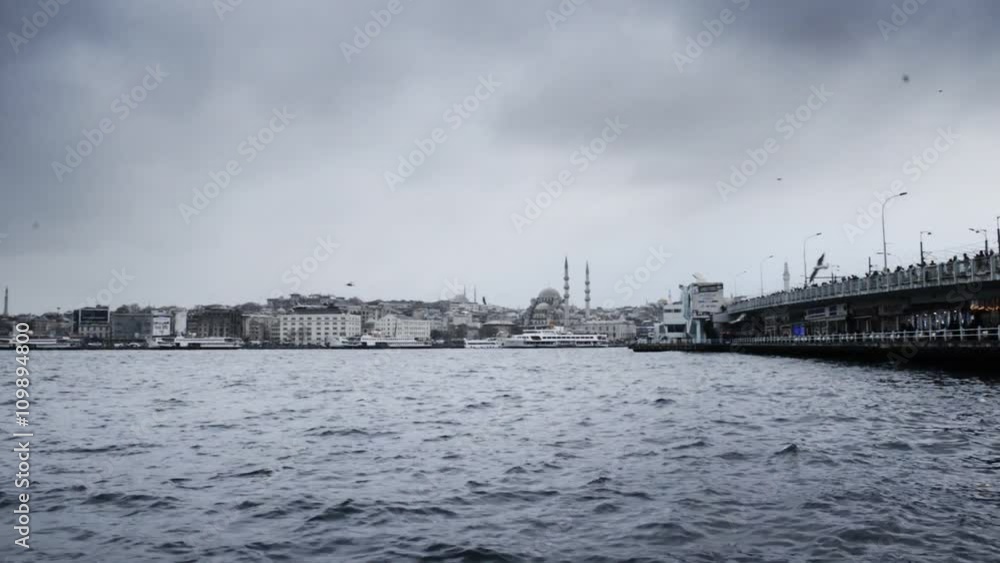 Big bridge with fishermen, sea and oldest mosque Big bridge with fishermen, sea and oldest mosque
