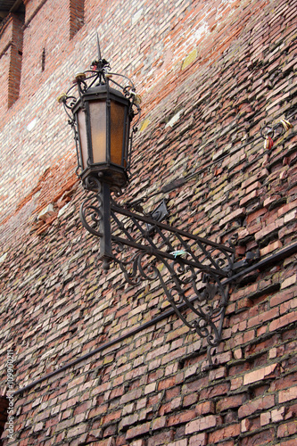 elegant lantern on old brick wall