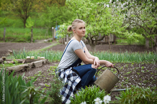 Obraz na plátně woman gardening outside in spring nature