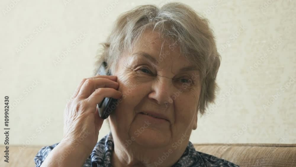 Old woman talking on a smartphone mobile phone Old woman talking on a smartphone mobile phone