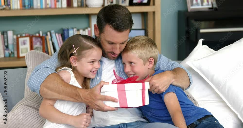 Father receiving a gift from his children Father receiving a gift from his children