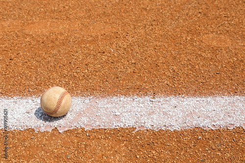 Baseball on a little league baseball field in spring