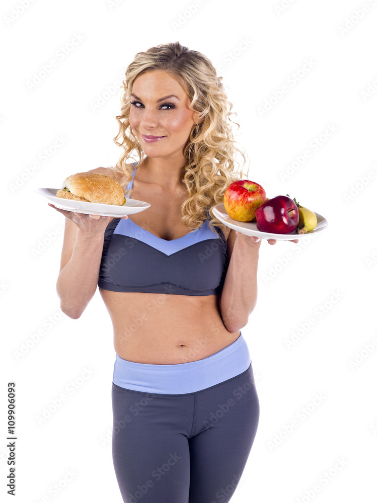 a sexy sporty woman with fruits and hamburger a sexy sporty woman with fruits and hamburger