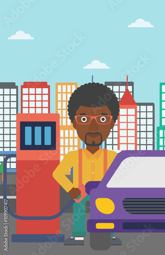 Man filling up fuel into car.